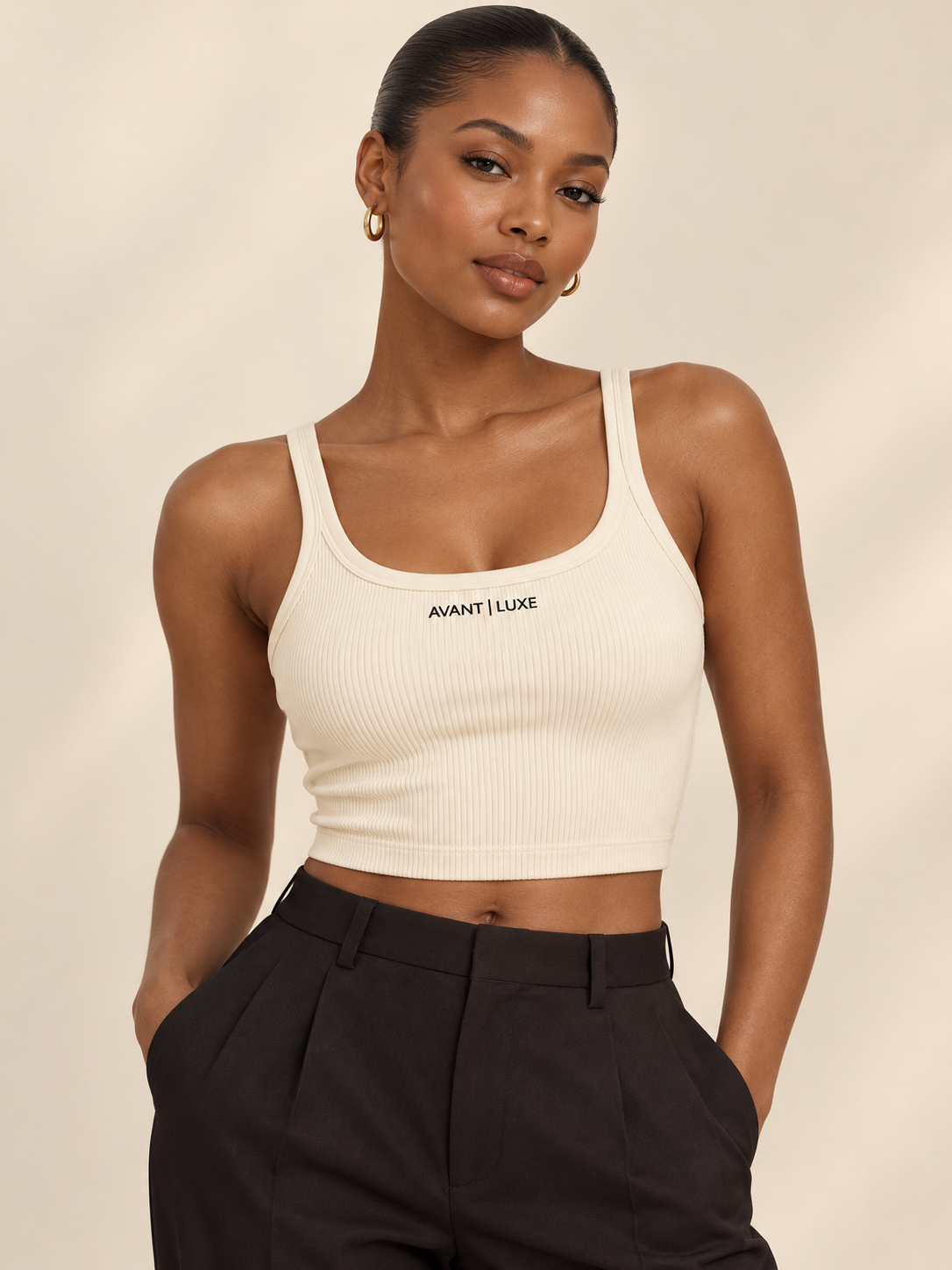 Illustrative styling image of model wearing Crème Avant Luxe ribbed tank
