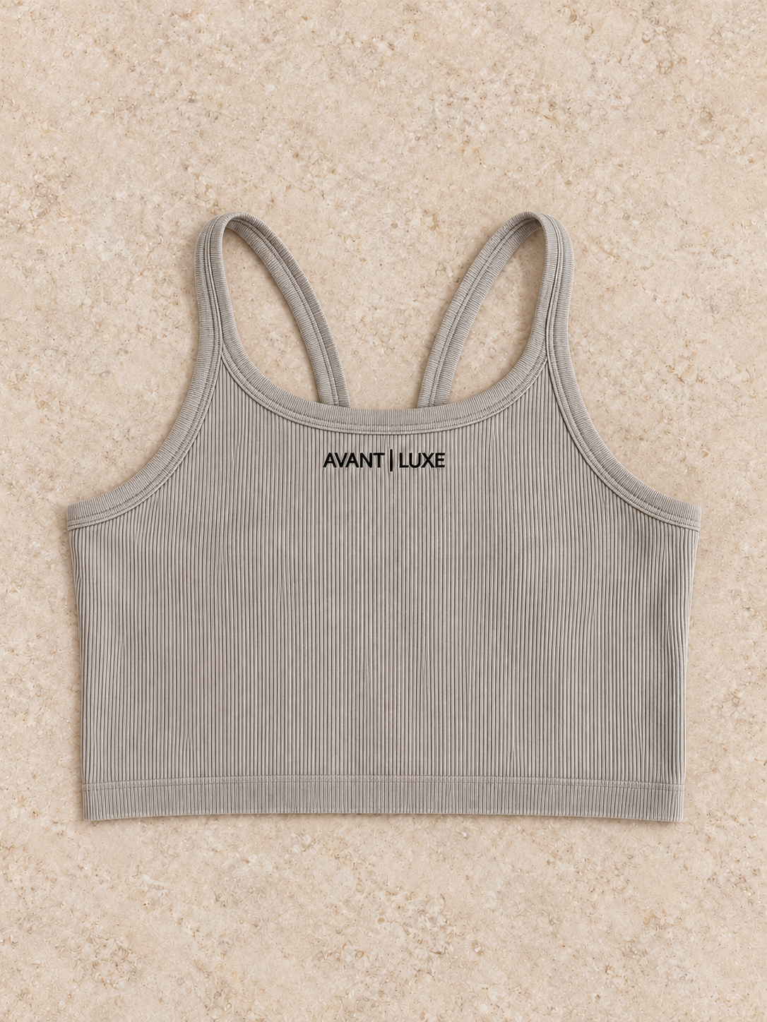 Mushroom ribbed Avant Luxe crop tank with small centered logo on warm stone