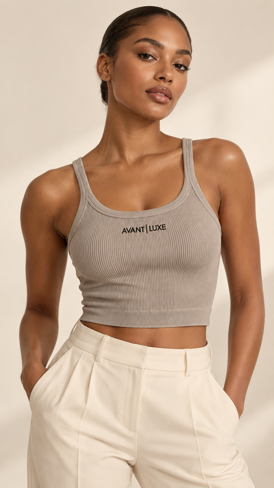 Illustrative styling image of model wearing Mushroom Avant Luxe ribbed tank