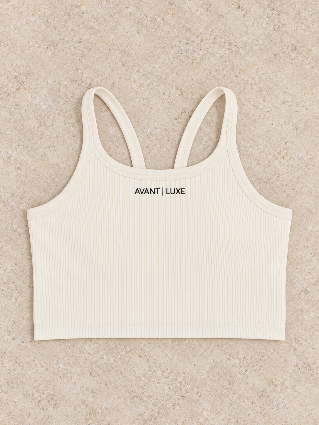 Crème ribbed Avant Luxe crop tank with centered small embroidered logo