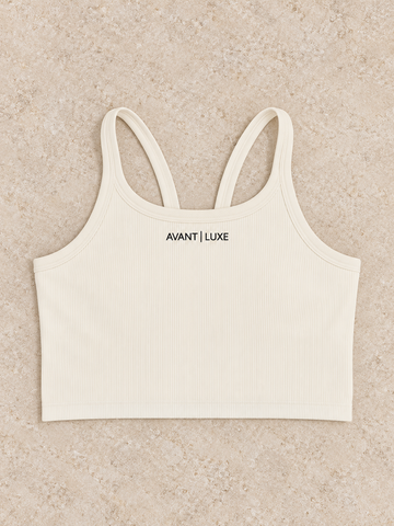Crème ribbed Avant Luxe crop tank with centered small embroidered logo